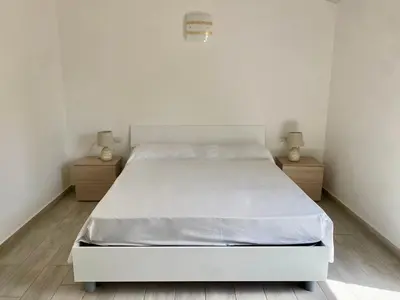 Letto o letti in una camera di Villetta 6 La Caletta