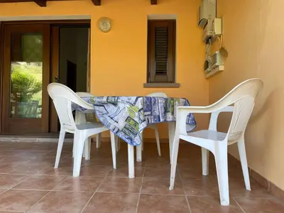 Area soggiorno di FAN SARD Villetta 10 posti letto FBU-ZAN02